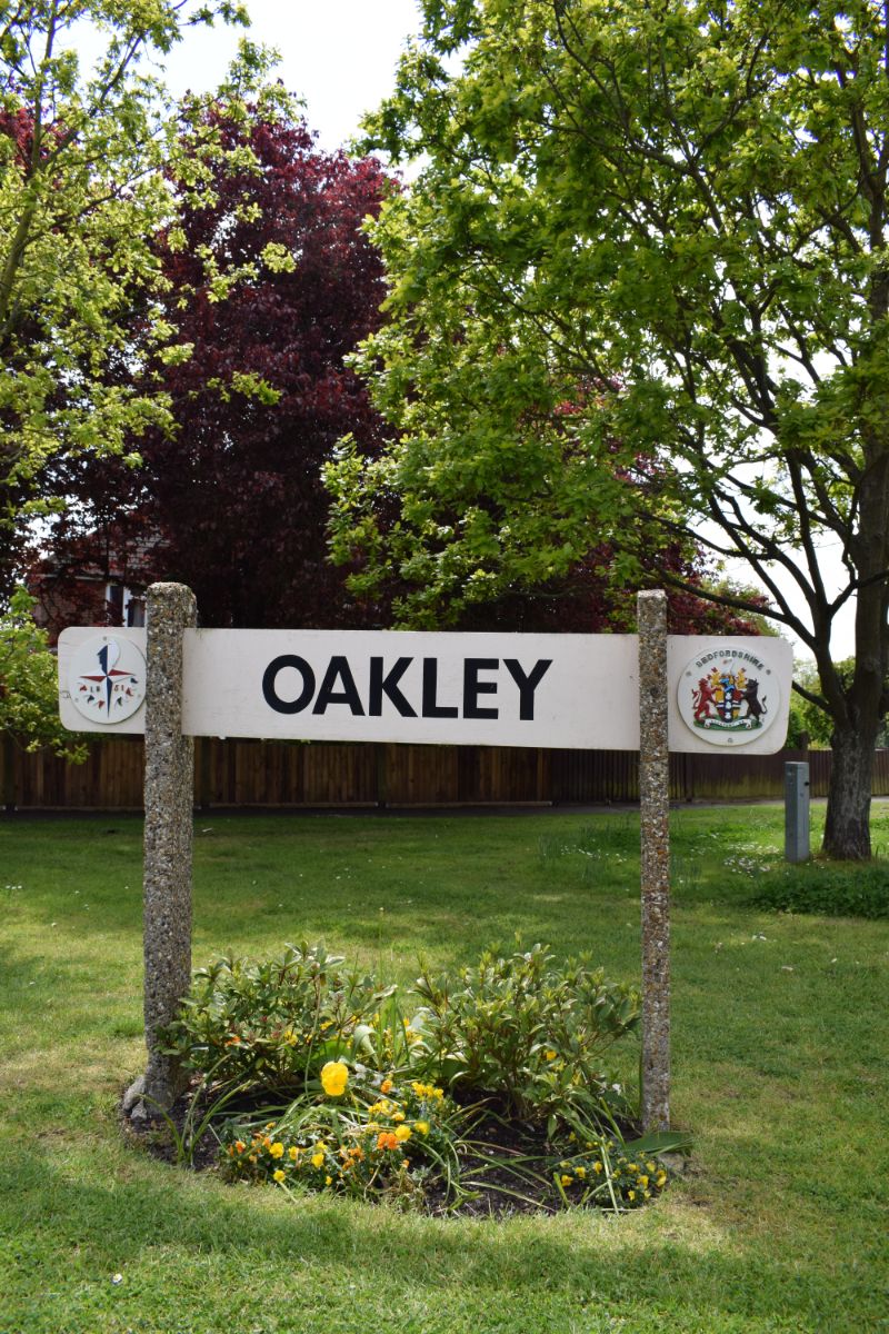 Oakley sign post Station Road / High Street